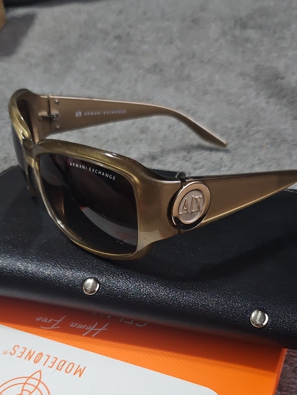 Armani Exchange AX062/S women's oversized wraparound sunglasses.